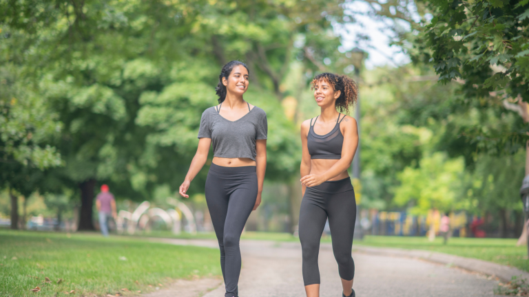 two women walking after reading kaizo healths top fitness hacks for new years resolutions